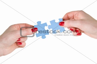  hands with different pieces of puzzle