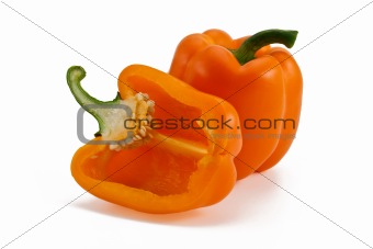 Two orange peppers isolated on white