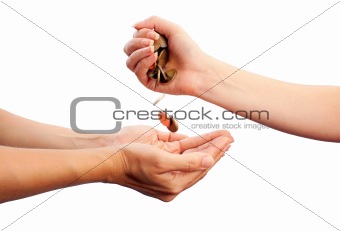 Female hand pour down coins into hands of another person