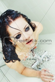 Young attractive woman taking shower