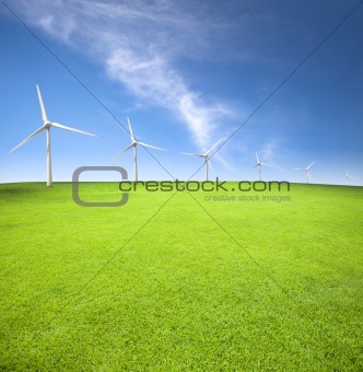 Wind turbines in an green field with cloud background