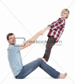 father and son having fun fooling around with each other - isolated on white