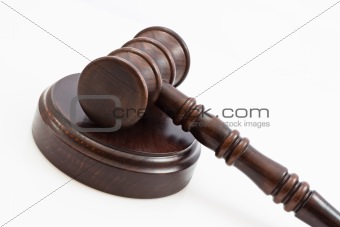 folded down lwooden judge gavel and stand