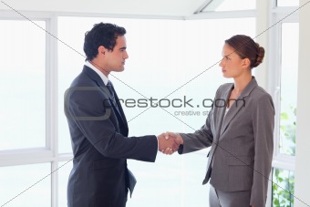 Side view of trades partner closing deal