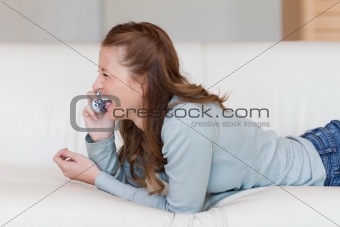 Young female laughing over the phone