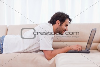 Handsome man using a laptop