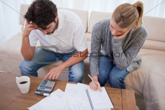 Couple looking at their bills