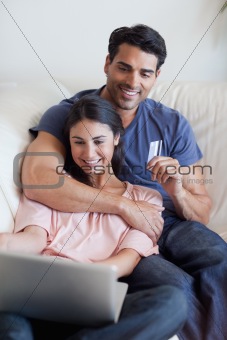 Portrait of a couple booking their holidays online