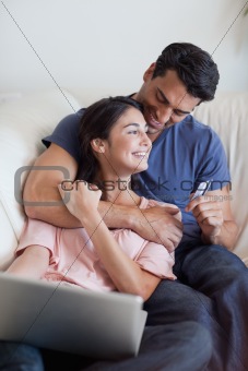 Portrait of a lovely couple booking their holidays online
