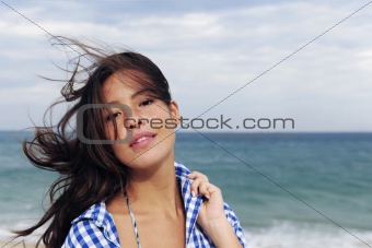 wind: woman with tousled hair at the sea 