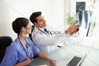 Doctors looking at a set of X-ray