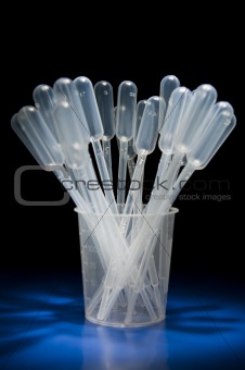 Pack of pipettes standing in measure glass