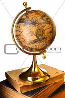 Antique globe on books