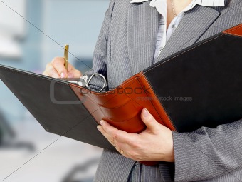 Businesswoman filling a form
