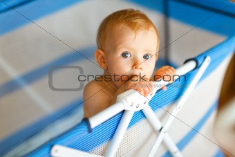 Portrait of baby in playpen
