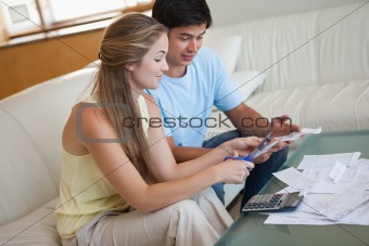 Couple cutting their credit card