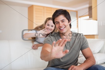 Couple waving at the camera