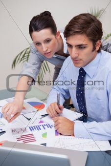 Business team working on statistics together