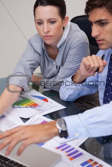 Business team analyzing charts together