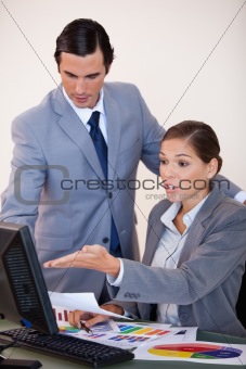 Business people analyzing statistics together
