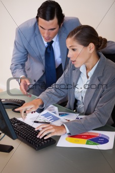 Business people working on statistics together