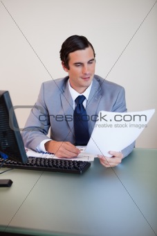 Businessman having a look at a contract