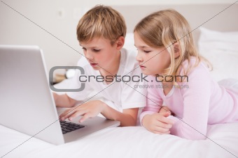 Cute children using a laptop
