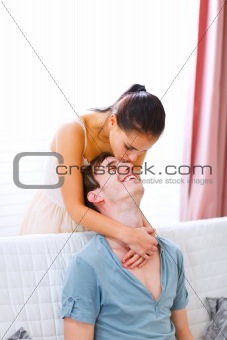 Cheerful couple in love enjoying themselves at home
