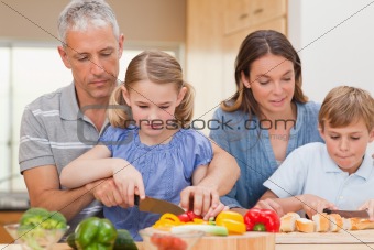 Charming family cooking together