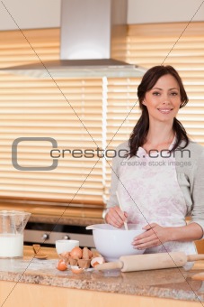 Portrait of a beautiful woman baking