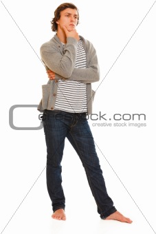 Full length portrait of thoughtful young man
