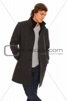 Portrait of thoughtful young man in winter coat
