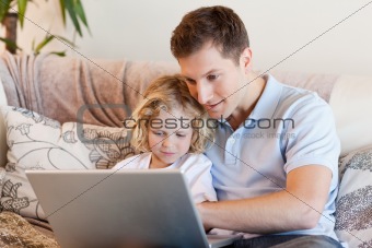 Father and son surfing the internet