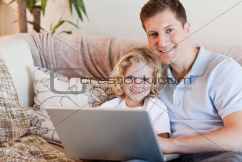 Father and son using notebook