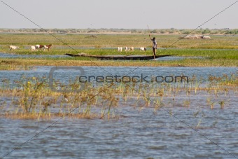 Fishermen in a pirogue in the Niger river.