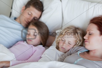 Family snoozing together