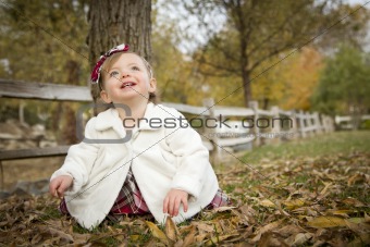 Adorable Baby Girl Playing Outside in the Park.