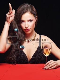 woman holding dices on red table