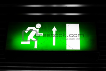 Closeup photo of an exit sign in the metro