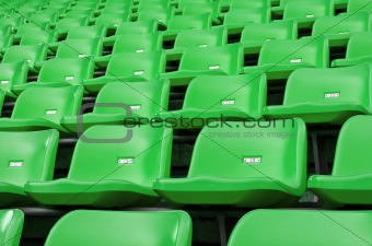 Green Empty plastic seats at stadium