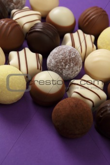 Chocolates and truffles on purple