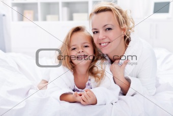 Woman and little girl after bath