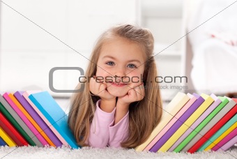 Little girl discovering the world of books
