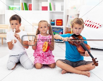 Kids playing on musical instruments