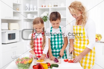 Family preparing fresh salad