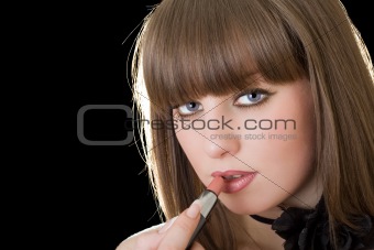 Portrait of the pretty girl with lipstick