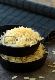 raw rice  on a wooden board