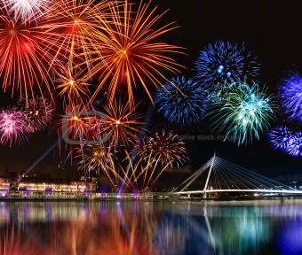 Colorful fireworks near water