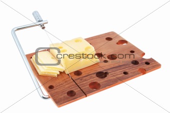 Wooden cutting board with cheese slices