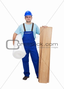 Worker ready to lay laminate flooring